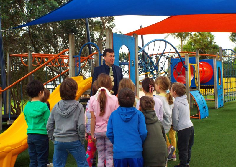 Martyn Wetherill with students in a school playground