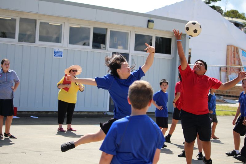 Students playing volleyball